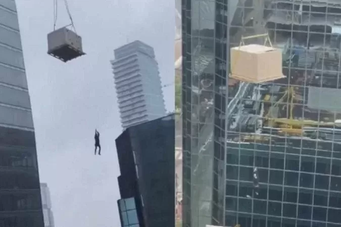 Homem fica pendurado em guindaste a mais de 100 metros de altura